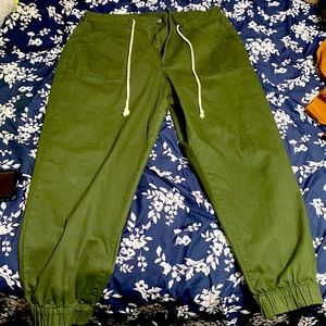 Green cargo pants with cuffed ankles